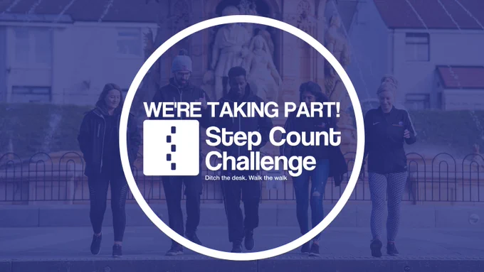 A white Step Count Challenge logo with text reading, "We're taking part!" with a blue transparent filter over five people in dark clothing walking towards the camera, away from a fountain in an urban park.
