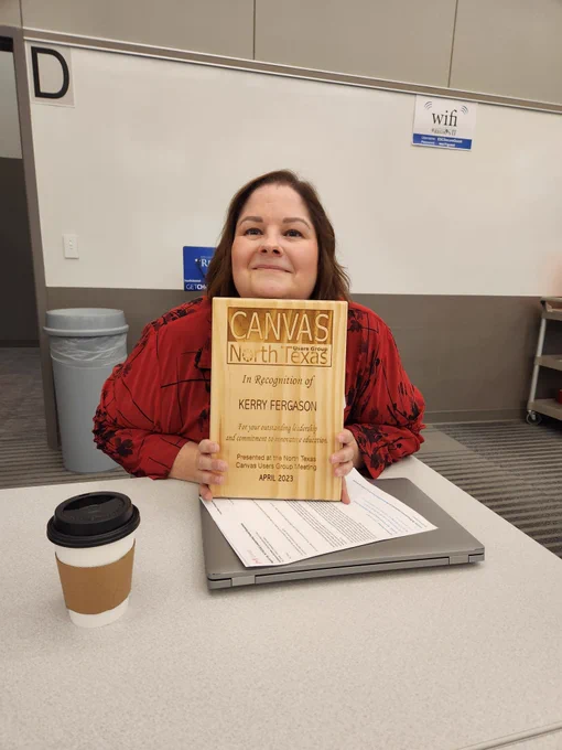 Kerry holding a recognition plaque