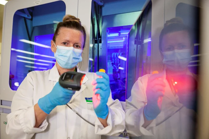 THP medical laboratory professional holding a scanner