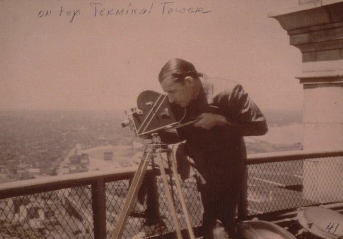 Ray Culley shooting a film scene from atop the Terminal Tower in 1941 | Image courtesy of Hagley Museum and Library, Cinecraft Productions Collection