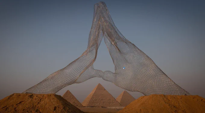 Italian artist Lorenzo Quinn's 'Together,' displayed near the Great Pyramids of Giza