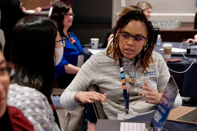 Attendees take turns interviewing each other in a hands-on exercise.