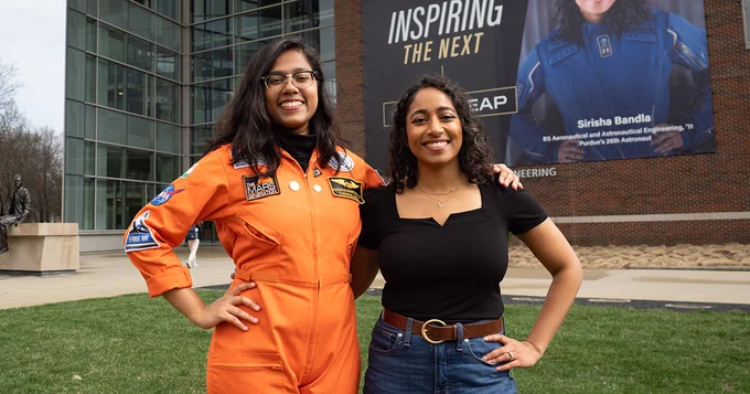 Student Thendral Kamal and alumna Sirisha Bandla standing in front of ARMS