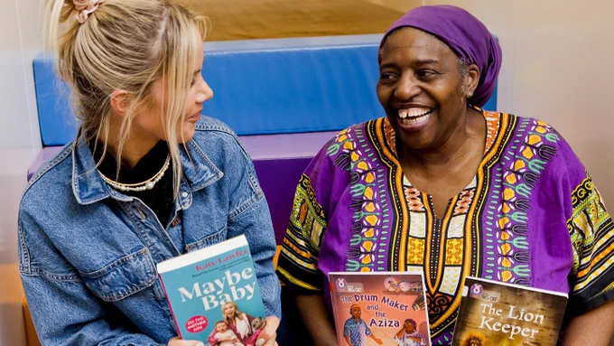 Photo of special guest authors Kate Lawler and Sandra Agard sitting with their books at the library following their engaging book readings