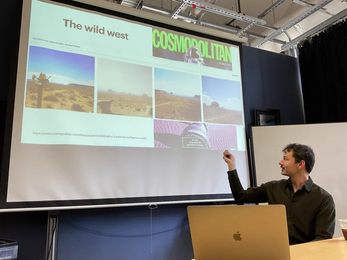 Jeremy Warner pointing at a slide showing text-to-image examples in the BiD lab at UC Berkeley.