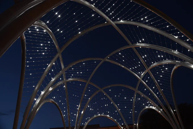 A close up view of the tiny lights in the memorial sparkling like stars. 