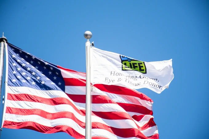 Donate Life flag and American Flag flying