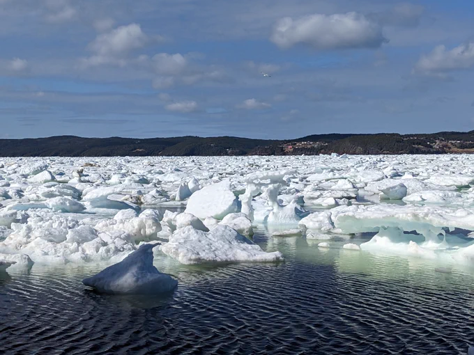 In the front: A giant Hershey's Kisses shaped piece of ice. In the middle: An ice inukshuk.