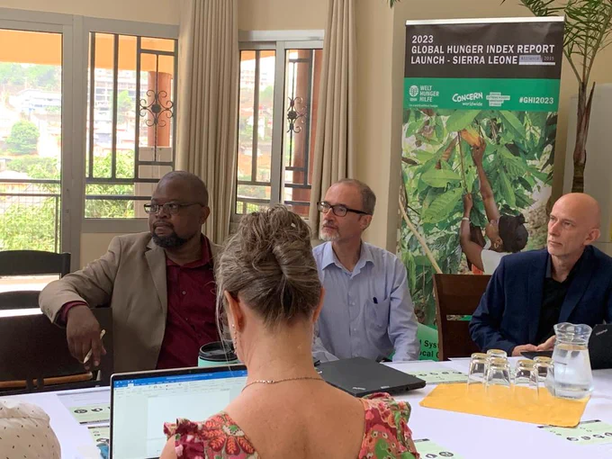 Stefano Temporin - Country Director @WHHSLE  (on the right), Austin Kennan - Country director Sierra Leone @concern (centre) & Gospel Matondi -  Programm Director at @WHHSLE (on the left) listeing to an intervention at the launch of Global Hunger Index Report 2023 on 18 April 2023 at the German Residence in Freetown.

(c) German Embassy