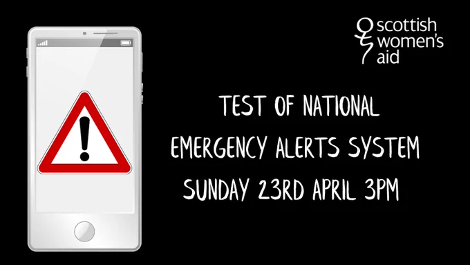 Black slide with image of a phone with a warning triangle on it. The text reads: ''Emergency Alerts System test Sunday 23rd April 3pm.''