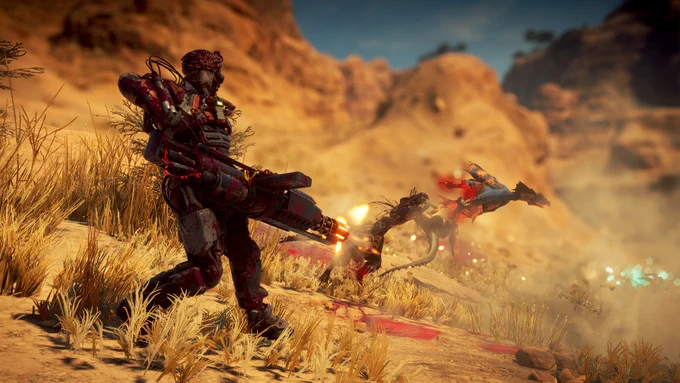 A woman wearing an exosuit is firing a minigun at a mutated raptor and another dinosaur that is gliding using wings. They're in a savanna.