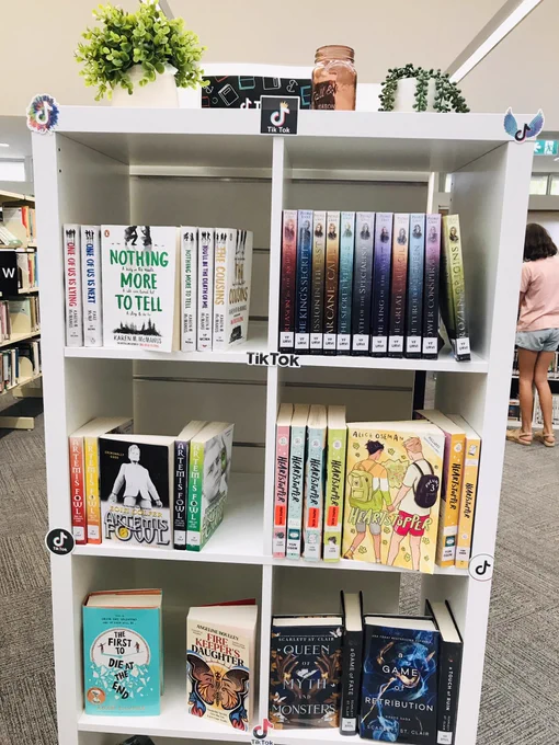 Book shelves with TikTok logo on top.