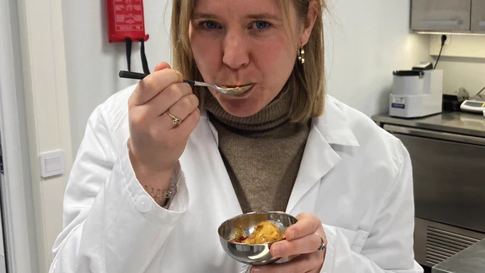 Reporter Rosie Blunt eating a bowl of ice cream made from bacteria