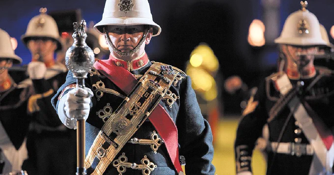 Man marching as part of Edinburgh Tattoo event