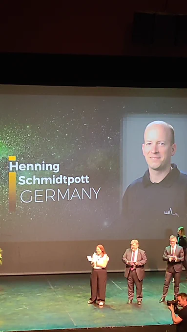 Henning collects his award