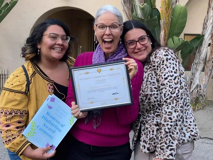 Photo of Steph, Magdalena and Maria at the WRC Womxn of Distinction Award Ceremony. 