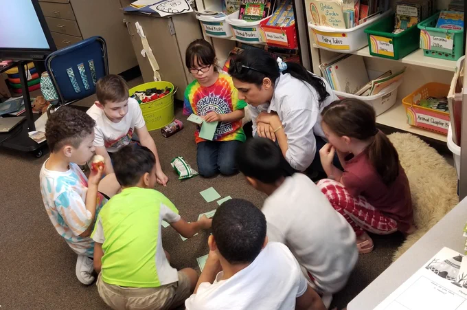 Students and teacher playing a game