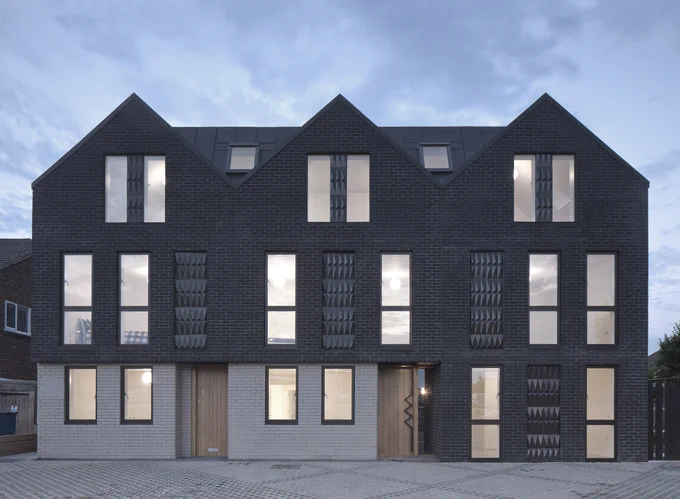 HADDO YARD - 7 new build flats by Denizen Works - with Arrant Land. Photos by David Barbour. The character of the building takes its cues from the local context, with the dark brick gables evoking the distinctive forms and tones of the black timber fishing huts 