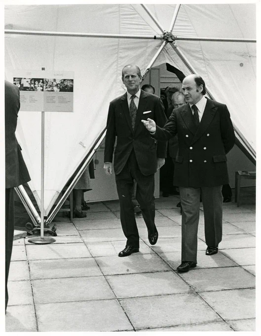 Harold Riley and HRH Prince Philip touring an art exhibition in Salford, 1980