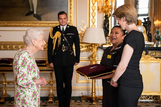 Her Majesty The Queen presenting the George Cross medal to the NHS’s May Parsons and Amanda Pritchard at Buckingham Palace in July 2022.