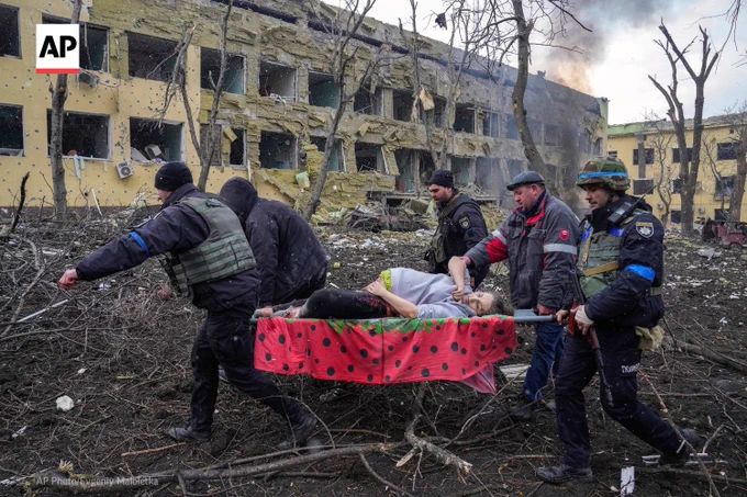 Iryna Kalinina, an injured pregnant woman, is carried from a maternity hospital that was damaged during a Russian airstrike in Mariupol, Ukraine, on March 9, 2022. 