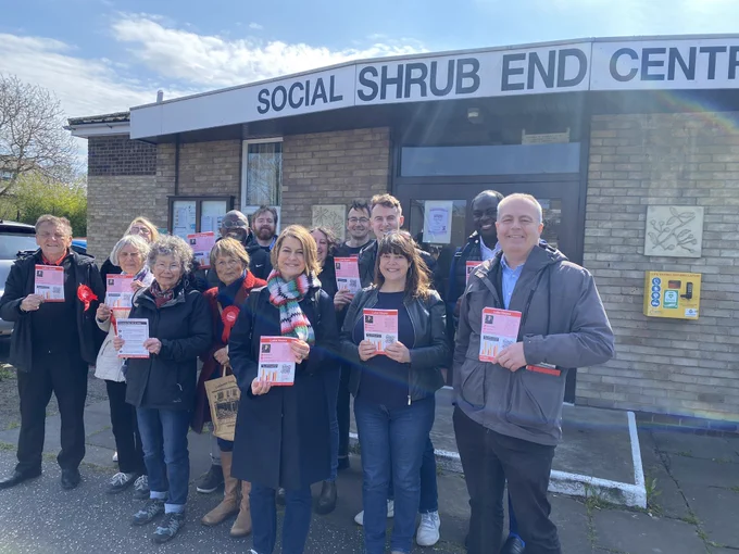Helen Hayes MP with a group of Labour Party activists standing outside the Shrub End Social Centre in Colchester