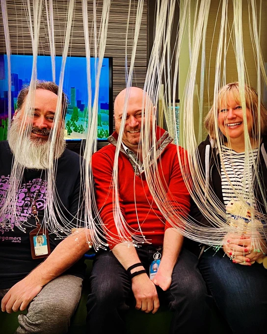 A pic of Bryce Johnson, Solomon Romney and Betsy Weber sitting in the octopus light at Microsoft’s Inclusive Tech Lab.