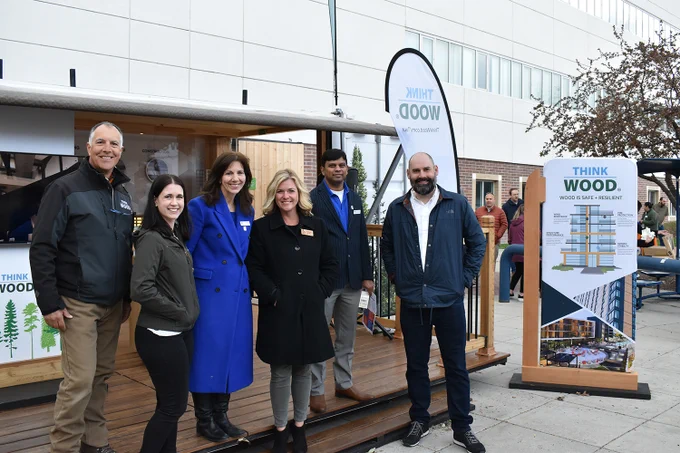 College of Engineering faculty and staff pose with partners from Think Wood, American Wood Council, and Idaho Forest Products Commission in front of the Think Wood Mobile Tour.