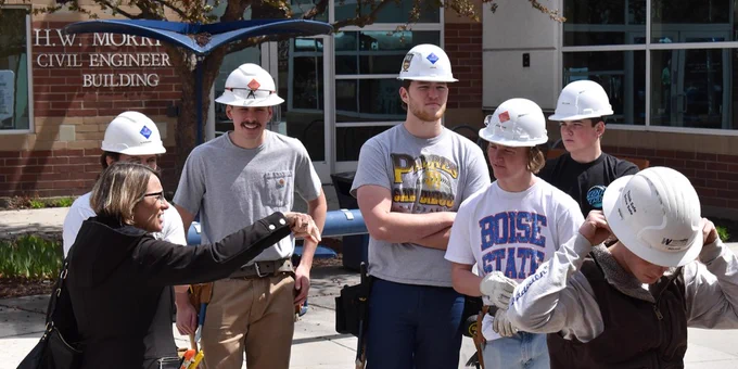 Construction Management undergraduates speak with College of Engineering Dean JoAnn Lighty at the Think Wood Mobile Tour. 