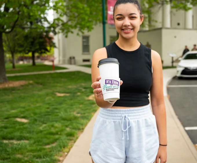 person holding a cup