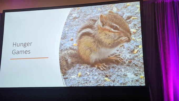 Chipmunk eating something with the text hunger games