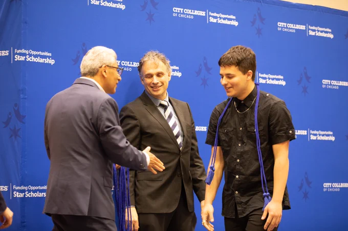 Image of Chancellor Juan Salgado and President Potash presenting chords to Start Scholarship students.