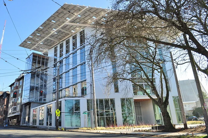 A photo of the Bullitt Center, located in Seattle. Small tree in the foreground. Image credit:  Image Credit: Joe Mabel CC ASA 3.0 