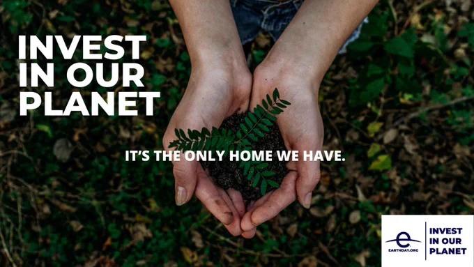 Image is of a person's hands holding a plant with dirt in them. The ground looks like a forest. Text on image reads: invest in our planet. It's the only home we have." with an earthday.org logo in the bottom right corner.