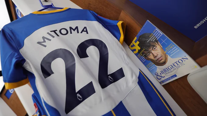 Kaoru's shirt hanging up in the changing room alongside a programme which features an amazing painting of him. More Mitoma magic in the FA Cup?