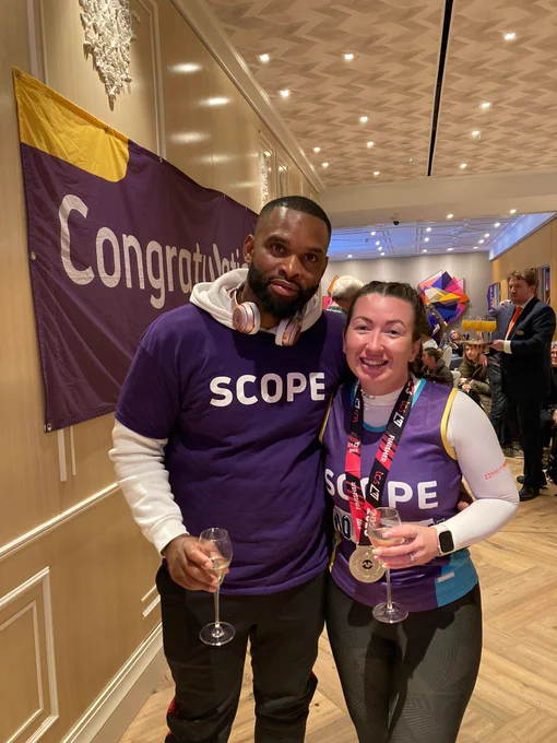 Scope runner alongside someone supporting them.