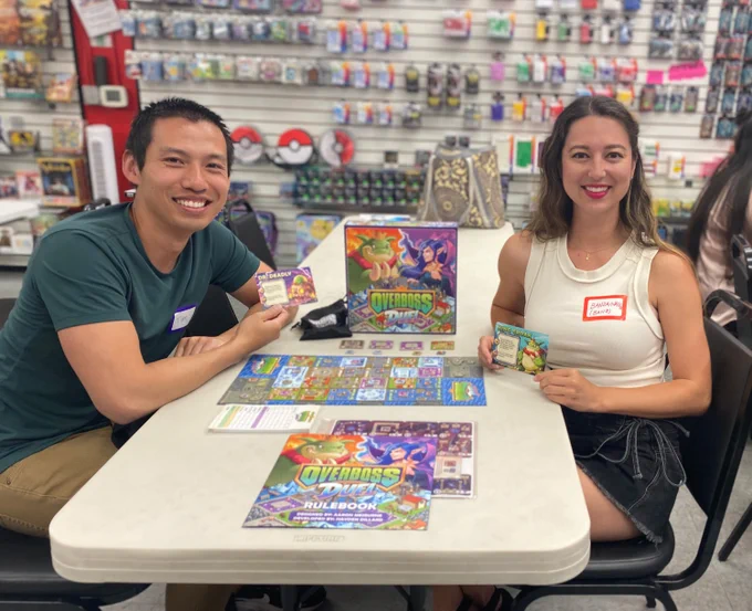 Tim Chuon and Banzainator playing a game of Overboss Duel at the Game Pathways meet-up