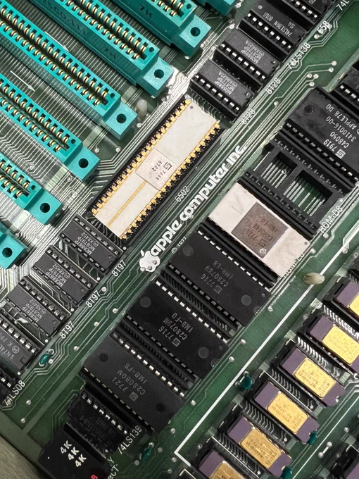 Close up photograph of the motherboard of a 1977 Apple II (revision 0) computer.
