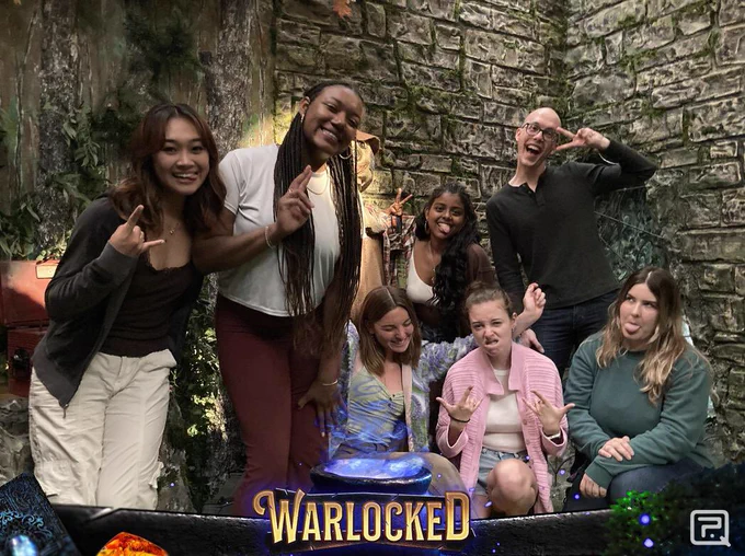 Seven people of the PRRISM lab celebrating an escape from the Warlocked escape room!
