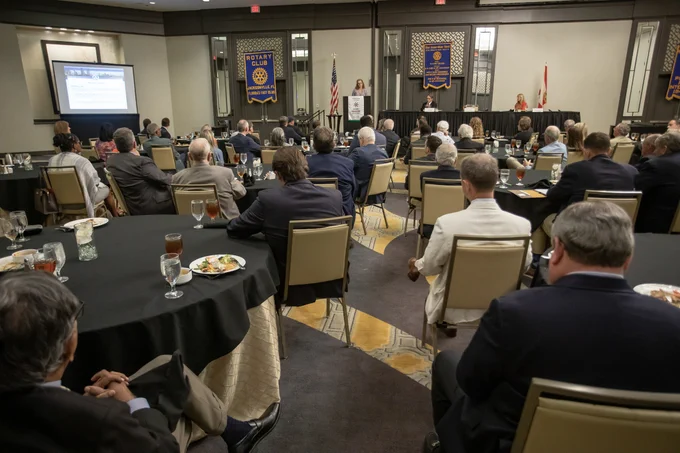 molly curry speaking in a large room