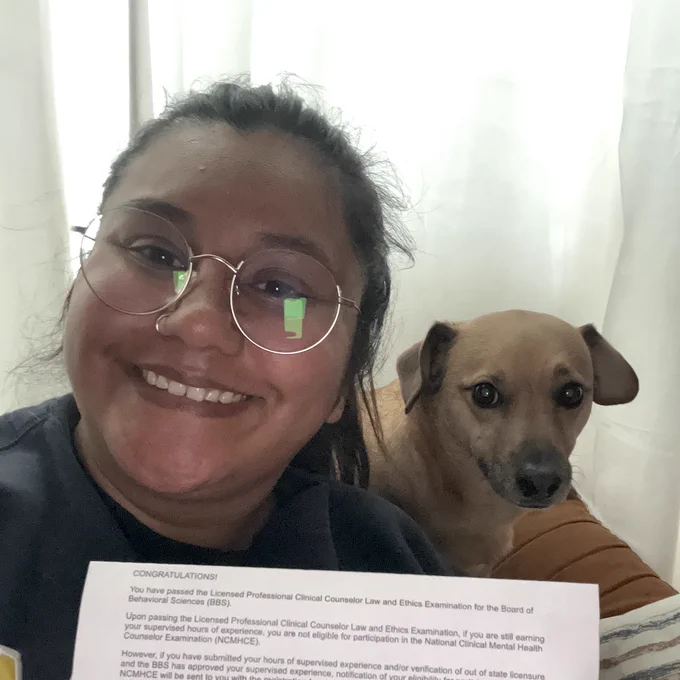 Karen with her exam results printout showing that she passed her test!