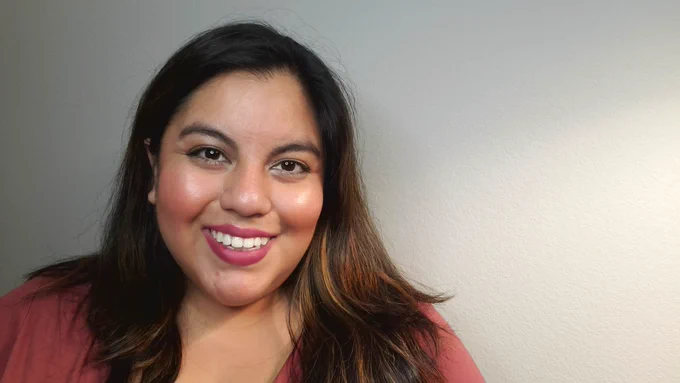 Jennifer, a Peruvian-American woman, smiles at the camera.