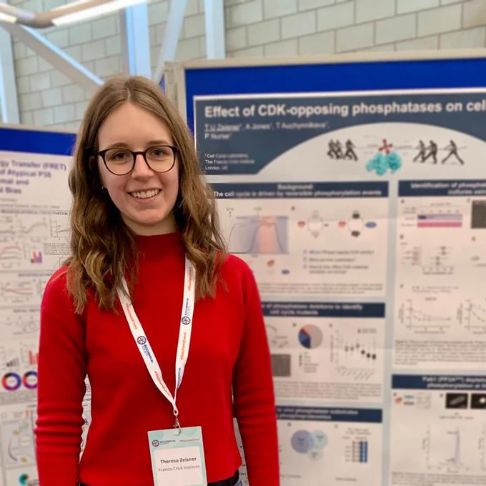 Theresa standing in front of her poster.