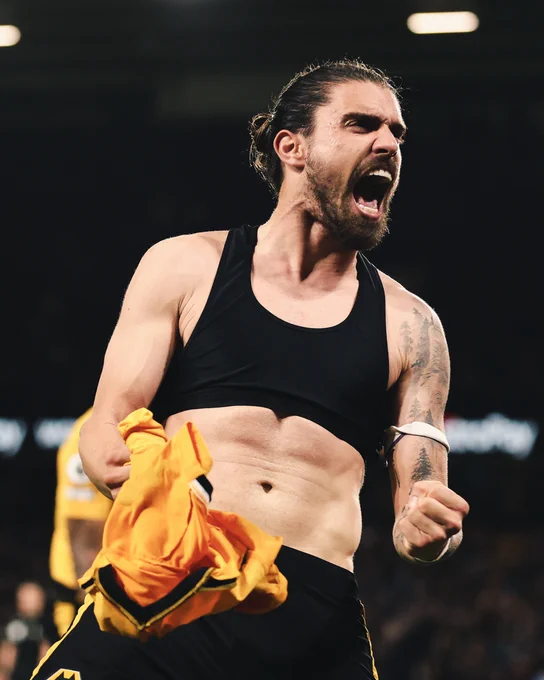 Ruben Neves celebrates in front of the South Bank after scoring from the spot.