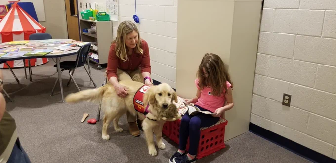 Student reading to dog