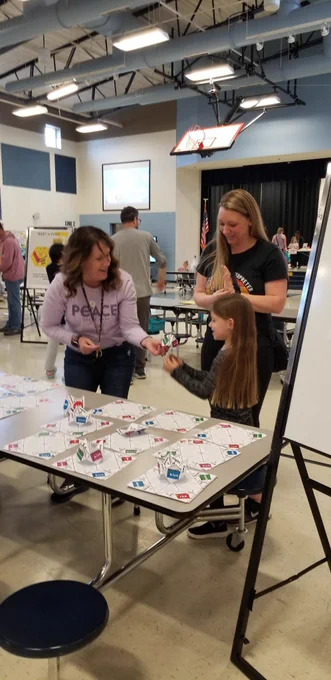 Teacher playing game with student 