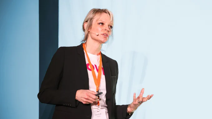 Genna Elvin from Tadaweb on the stage, speaking at Delano event
