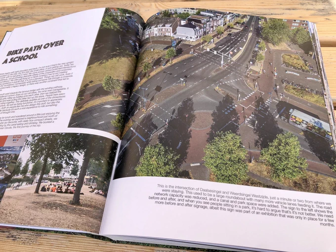 A coffee table book entitled “Fietspad”, which features large photos of cycle paths, intersections, and other infrastructure projects in the Netherlands.