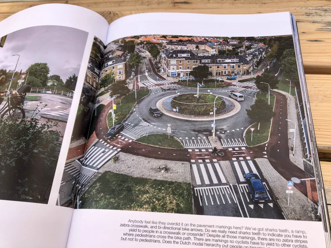 A coffee table book entitled “Fietspad”, which features large photos of cycle paths, intersections, and other infrastructure projects in the Netherlands.
