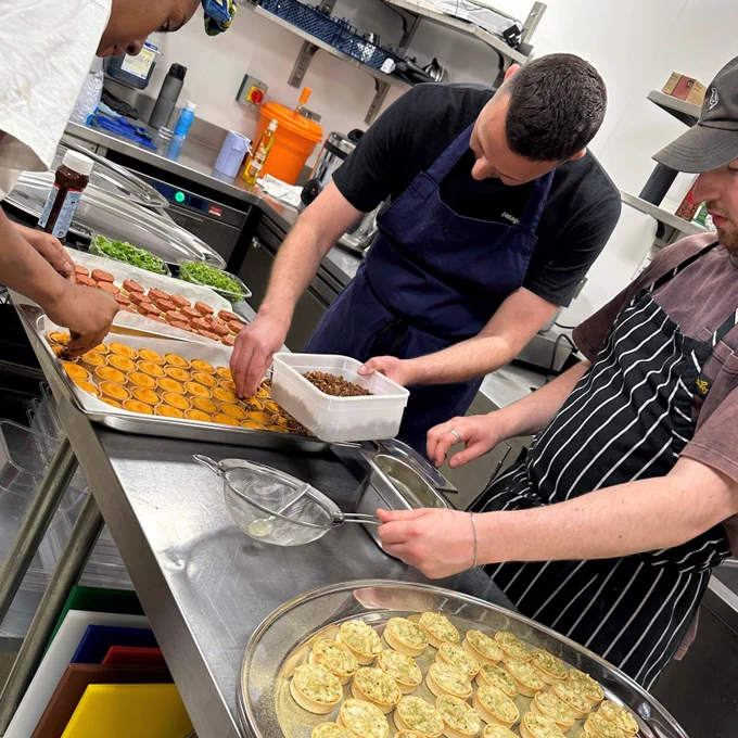 A photograph of chef's from Auld Hag in the kitchen preparing canapes 